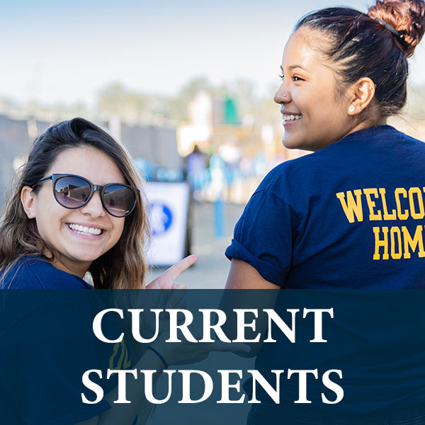 Two female students wearing UC Merced shirts